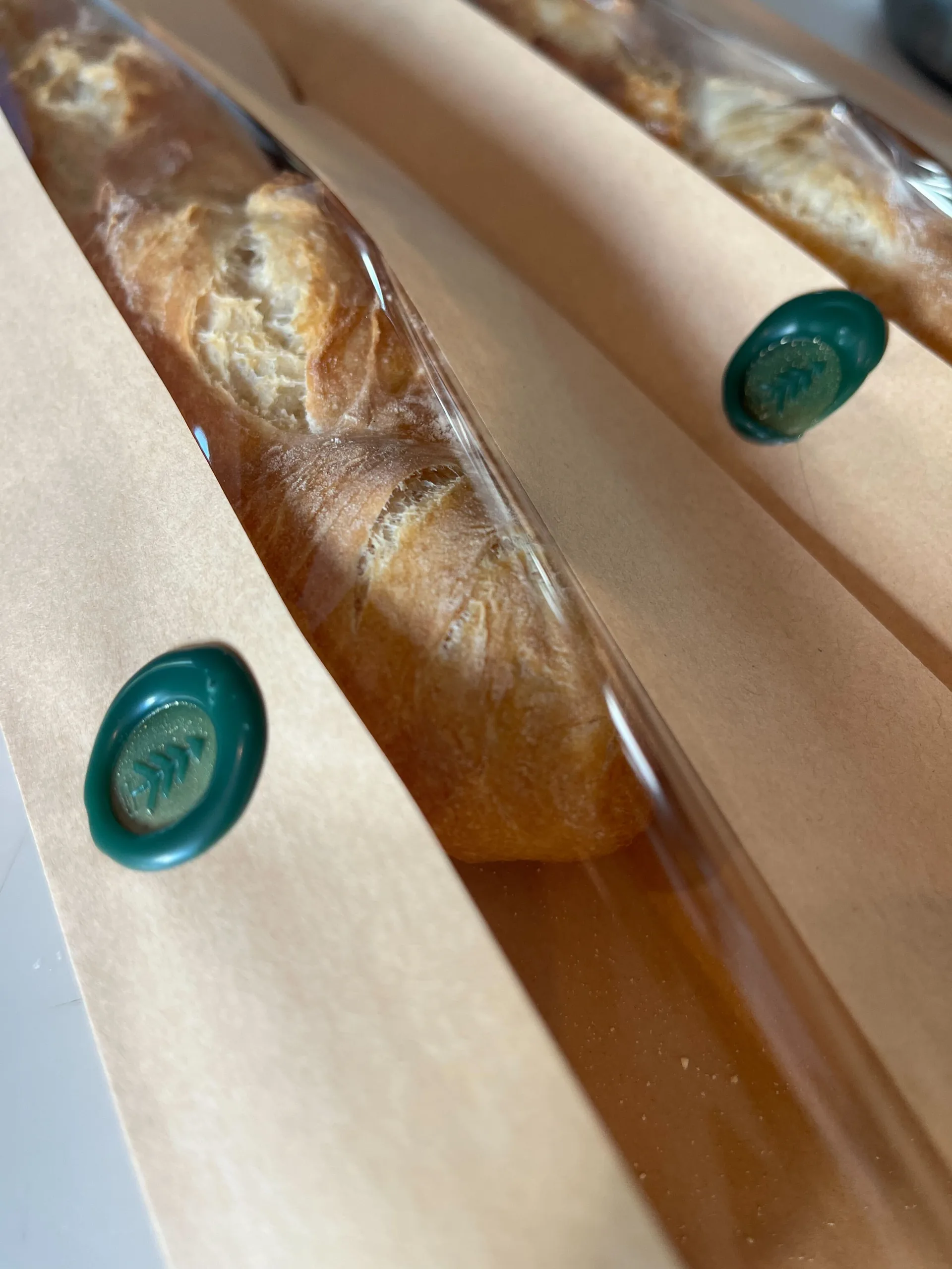 close-up of a baguette with a crackling crust and open crumb
